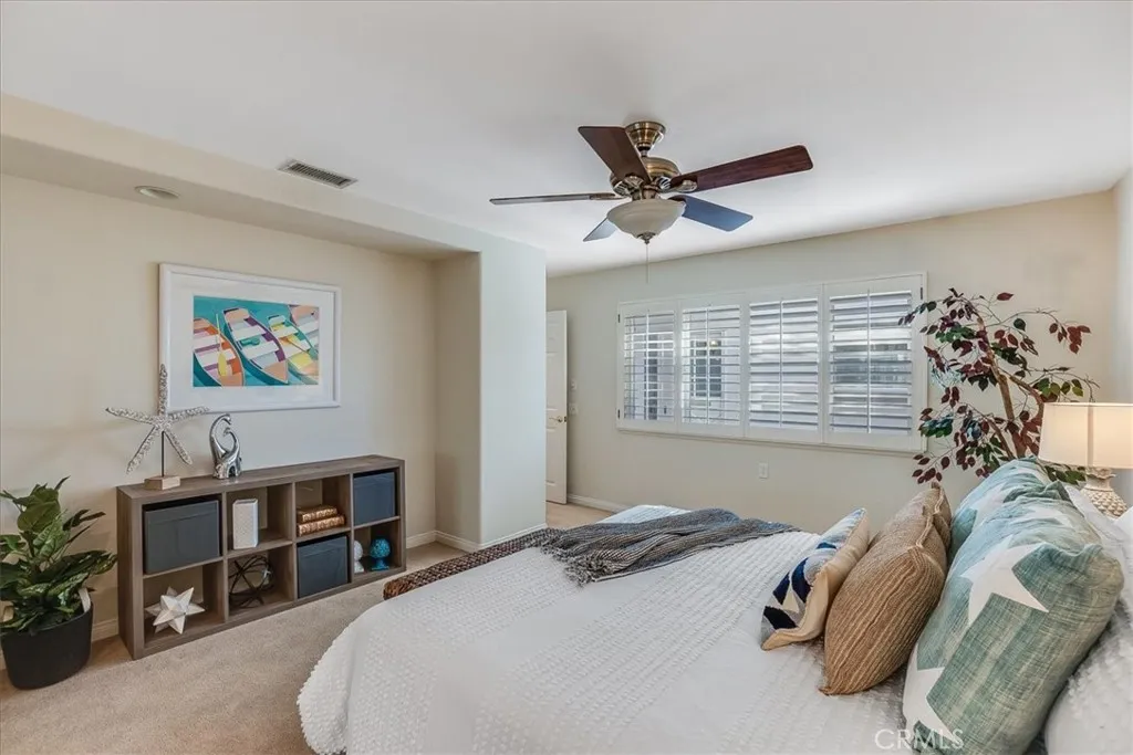 Primary bedroom has nook for desk or storage