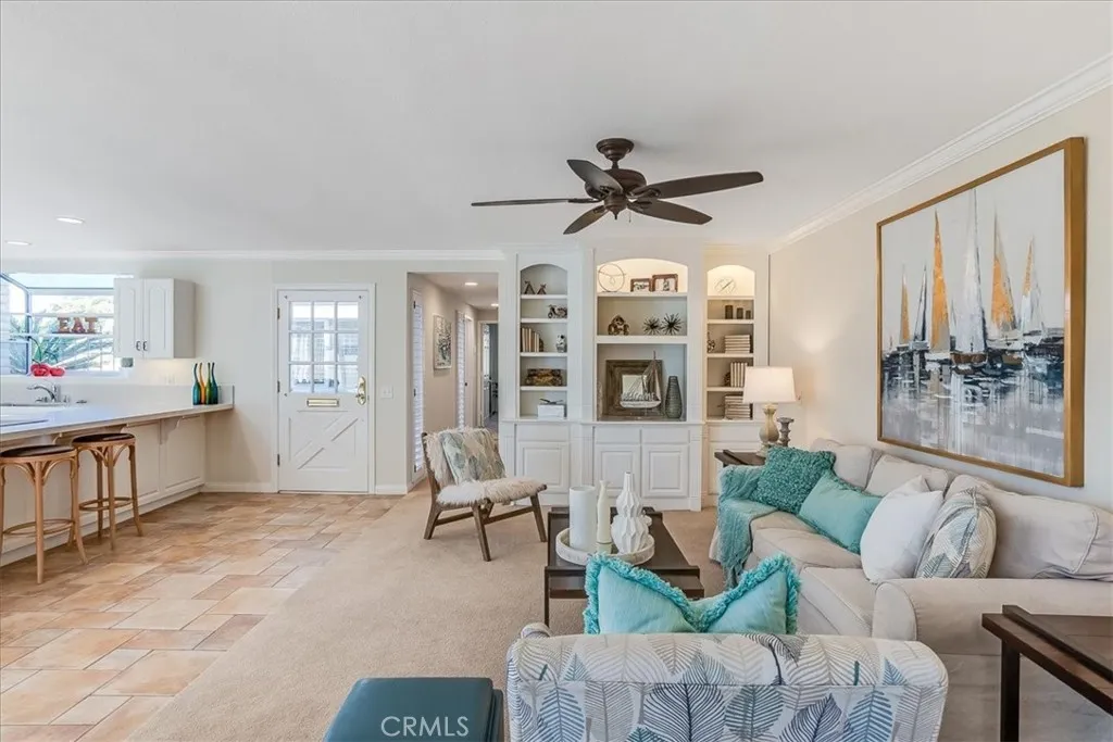 View from dining room to living room - ceiling fans too!