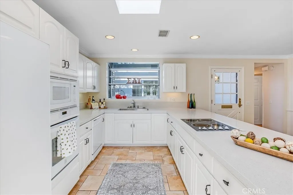 Upgraded cabinets, appliances and lighting.