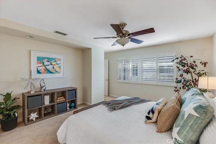 Primary bedroom has nook for desk or storage