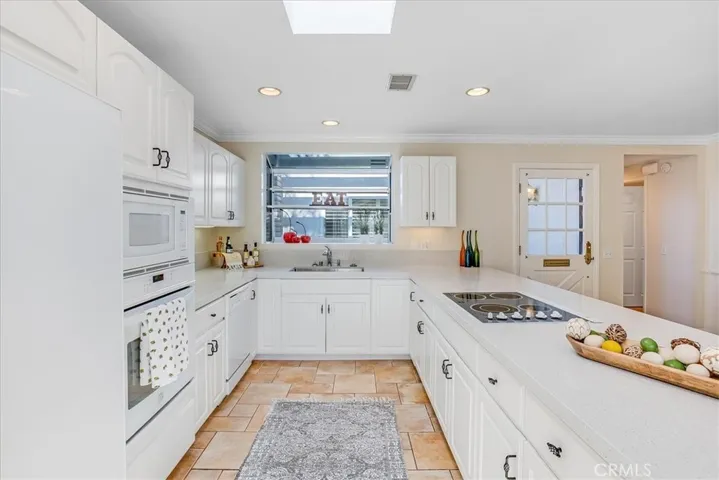 Upgraded cabinets, appliances and lighting.