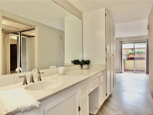 Vanity area leading to bedroom