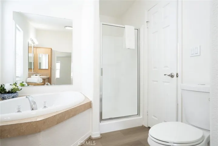 Primary Bathroom with soaking tub + walk-in shower