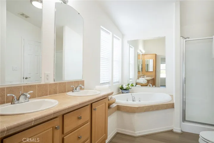 Primary Bathroom with soaking tub + walk-in shower