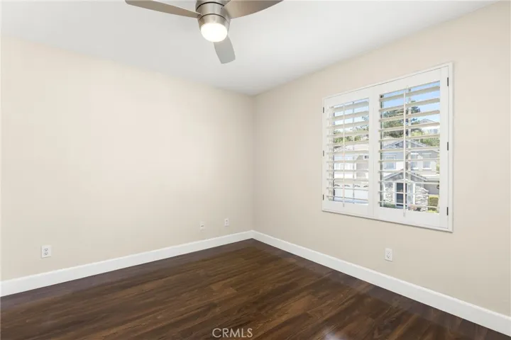 2nd bedroom also has plantation shutters and modern ceiling fan