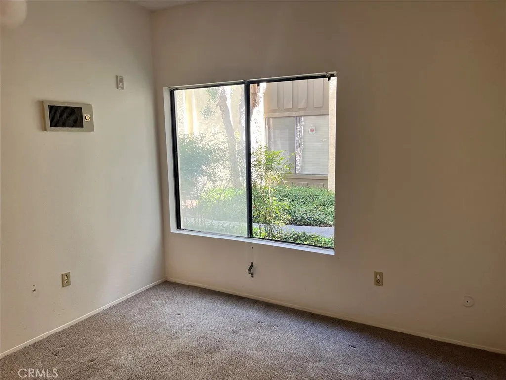 Large window opens to quiet greenbelt