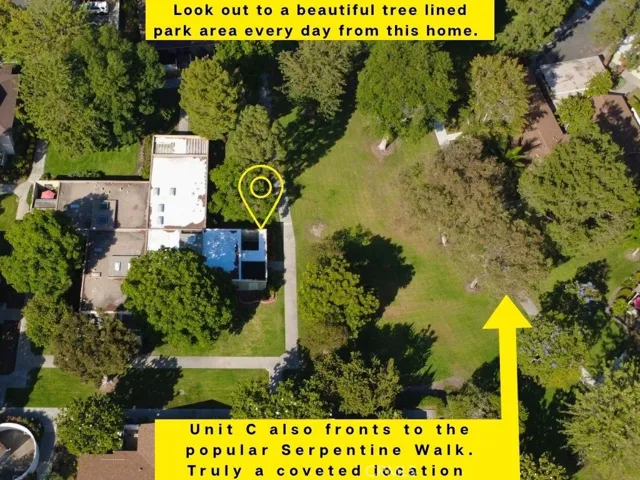 Aerial view highlights the home's coveted location along the community's historic Serpentine Walk, known for its scenic pathways and mature specimen trees.