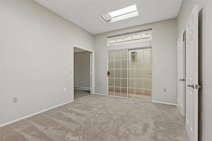 The permitted den/office/entertainment room offers a bright and inviting retreat with a skylight, and small outdoor atrium perfect for potted plants, a tranquil fountain, or get creative and come up with your own perfect idea.
