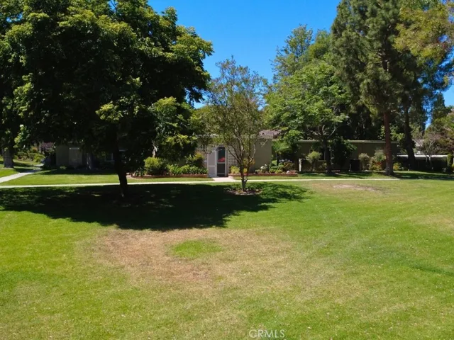 Beautifully maintained lawns and mature shade trees create an inviting outdoor environment ideal for enjoying the community's scenic surroundings.