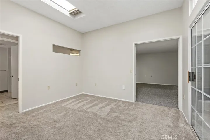The fully permitted den provides versatile additional living space, ideal as a home office, library, media room, or hobby area.