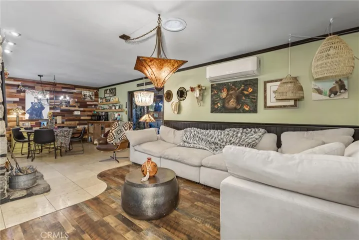 Living Room with Masonry Fireplace in center of home