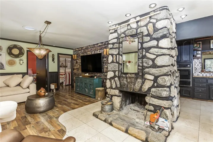 Living Room with Masonry Fireplace in center of home