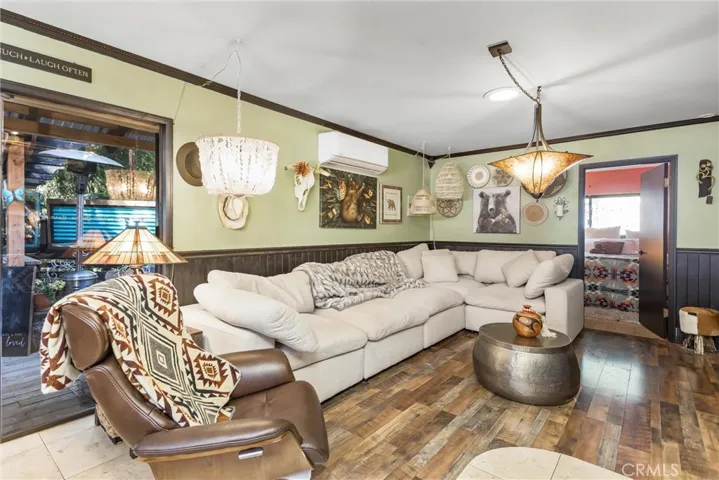 Living Room with Masonry Fireplace in center of home