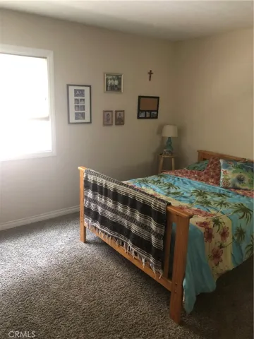 Downstairs bedroom with mirrored wardrobe closet