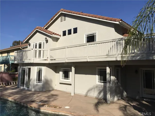 Balcony off of master bedroom with spiral staircase leading to pebble tech spa.