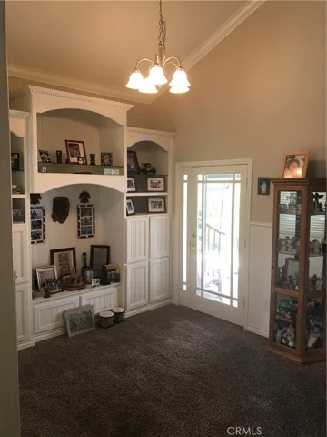 Dining room/craft area/work space downstairs off entry