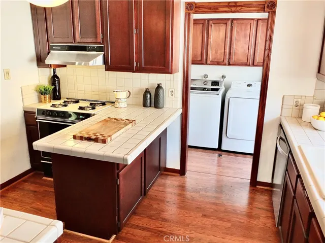 Kitchen with laundry room behind it