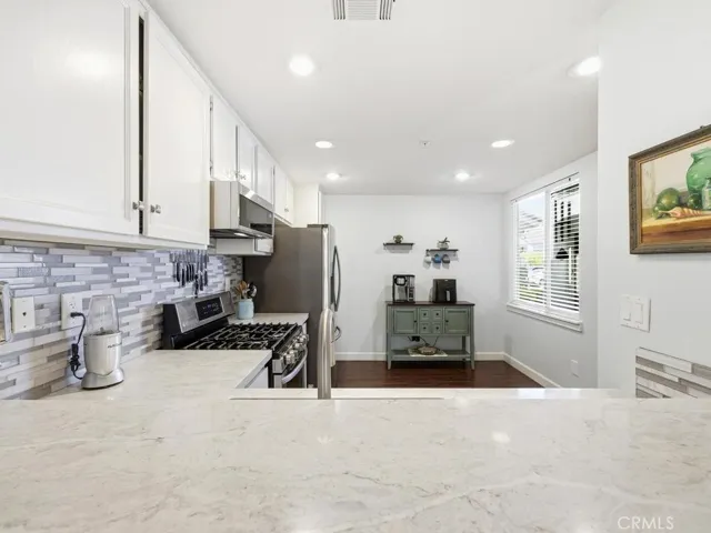 New cabinets faces, updated countertops, sink, back splash