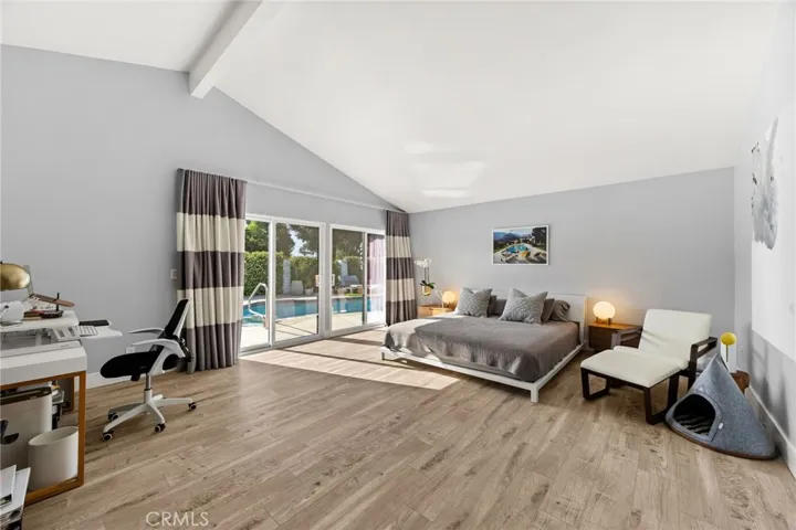 Primary Bedroom with a Pool View
