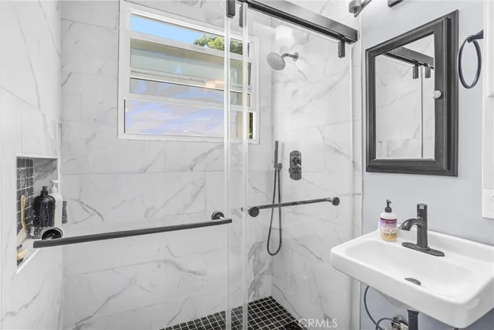 bathroom with updated shower