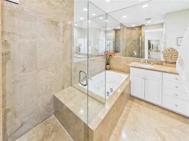 Primary bathroom has a jetted tub and separate shower