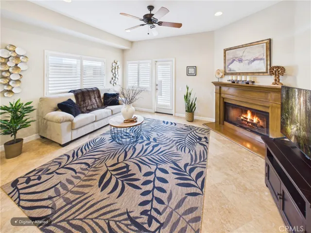 *Digitally added fire*COZY family room opens up to the kitchen.
