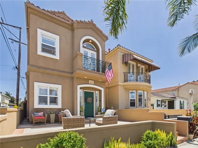 Front of home with large front patio.
