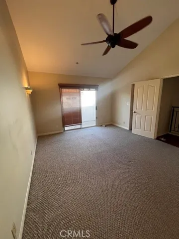 Principal bedroom facing sliding glass door to patio
