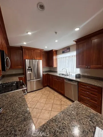 Kitchen with refrigerator.