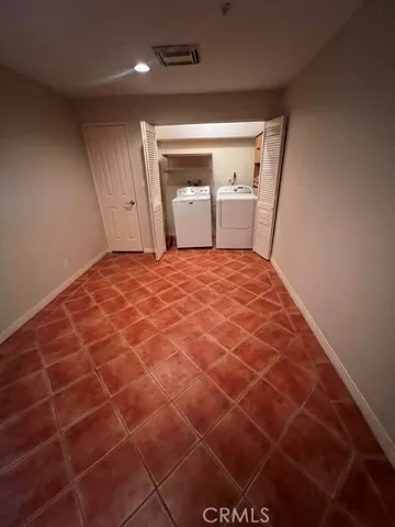 Downstairs bonus room and laundry with small closet