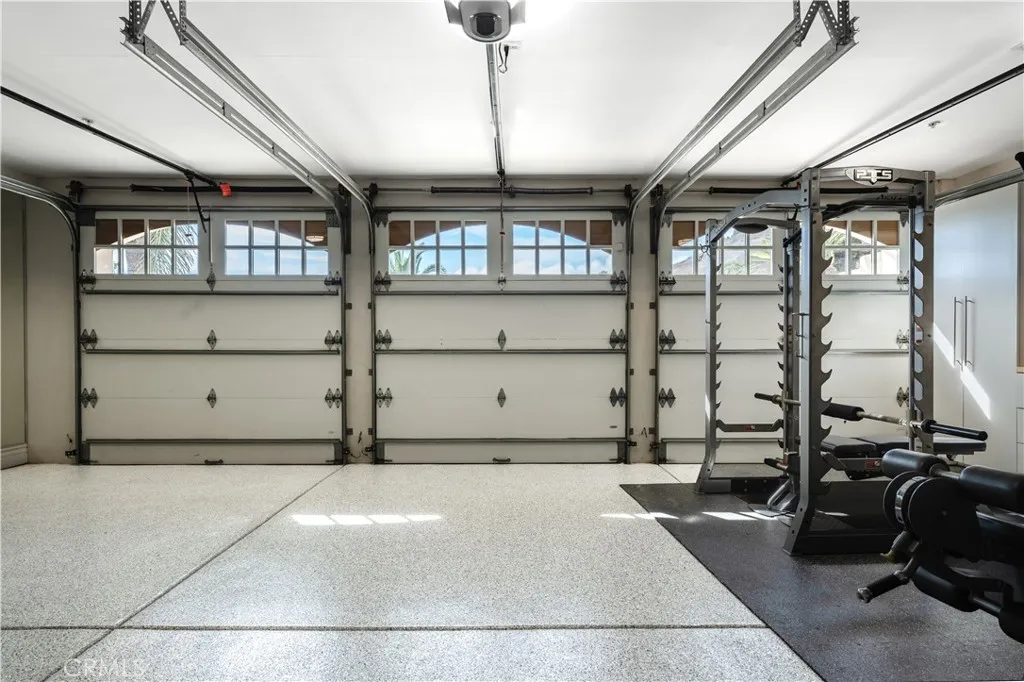 3-car garage with mirrors in a gym setting.