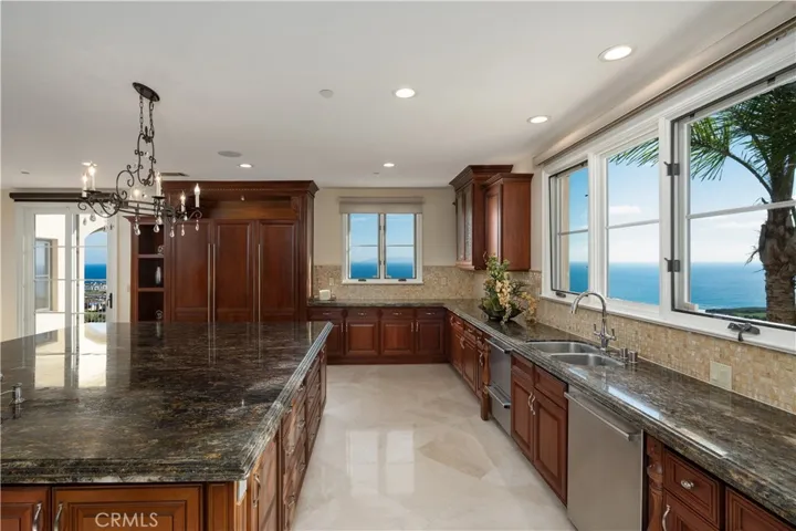 Kitchen wrapped around by ocean view.