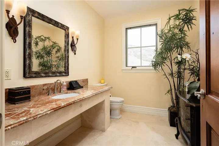 Powder room with sophisticated finishing.
