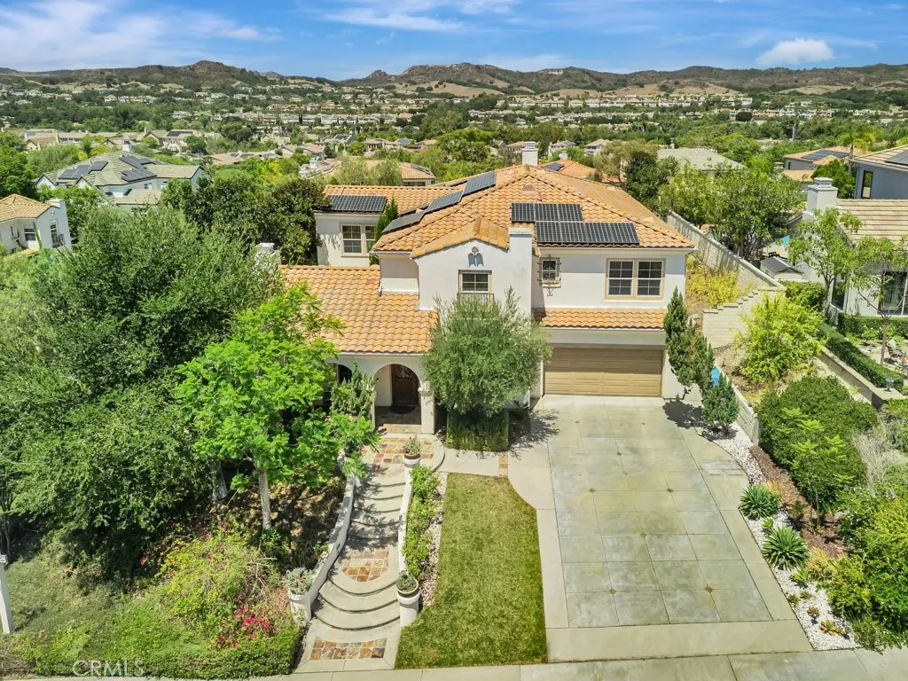 Spacious 3 car garage plus an extra long driveway that accommodates up to 4 additional vehicles, providing parking for up to 7 cars.