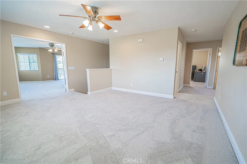 Loft with Primary on the left and Hallway on the right to Bedrooms