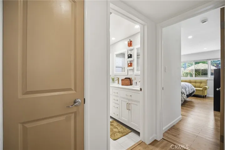 Hallway with Linen Closet looking into Back Bedroom