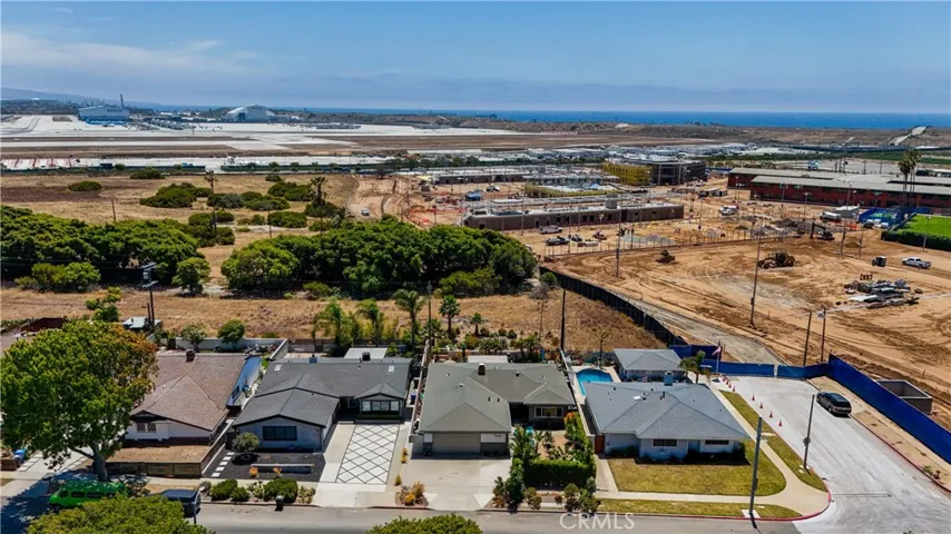 establishing Shot of Property with Lulu's Place being built in the background and the LAX.  Lulu's Place is scheduled to be completed in 2027. The area at the end of the paved street is not the entrance. The entrance is over on Manchester Parkway.