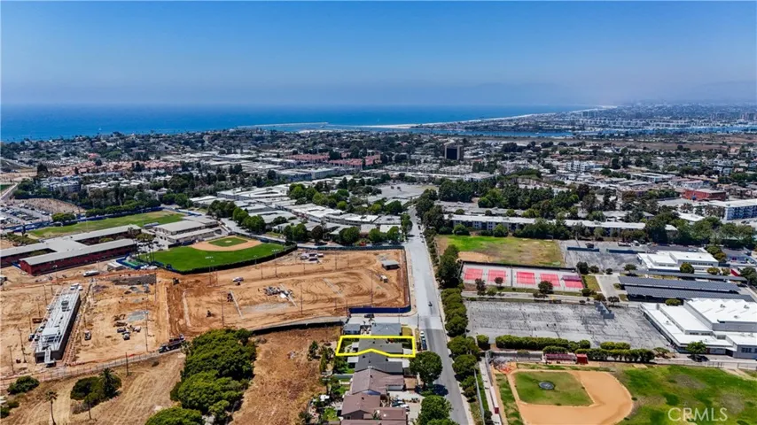 Another establishing shot showing Lulu's place to the left and a school on the right.