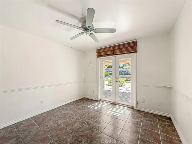 Bedroom #1 or office, playroom, etc with french doors leading to backyard