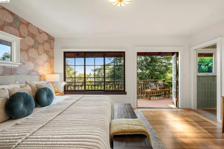 Hardwood flooring extending to a private exterior balcony
