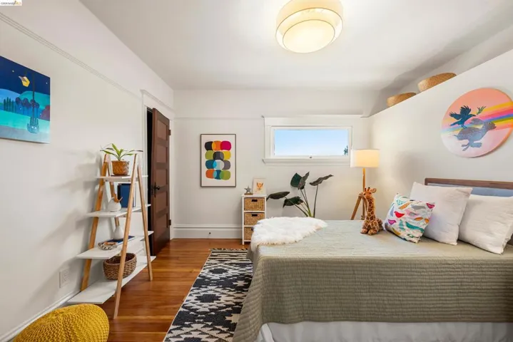 Hardwood flooring, a full-lite window, and a drum-style ceiling light fixture