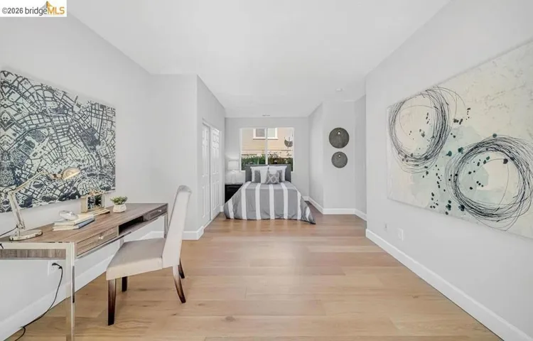 Light wood-finish flooring throughout this versatile space