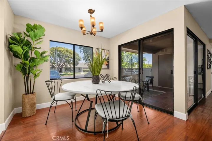 Dining Area with Sliding Door Access to Enclosed Front Porch