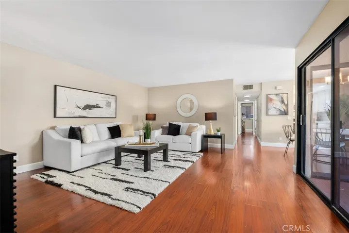 Living Room with Sliding Door Access to Enclosed Front Patio