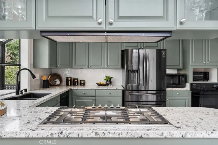 Quartz counters with gas range.