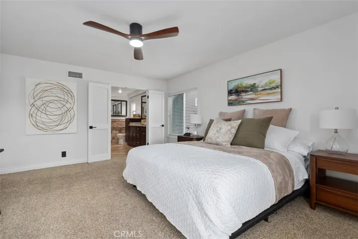 Primary bedroom with spacious bathroom.