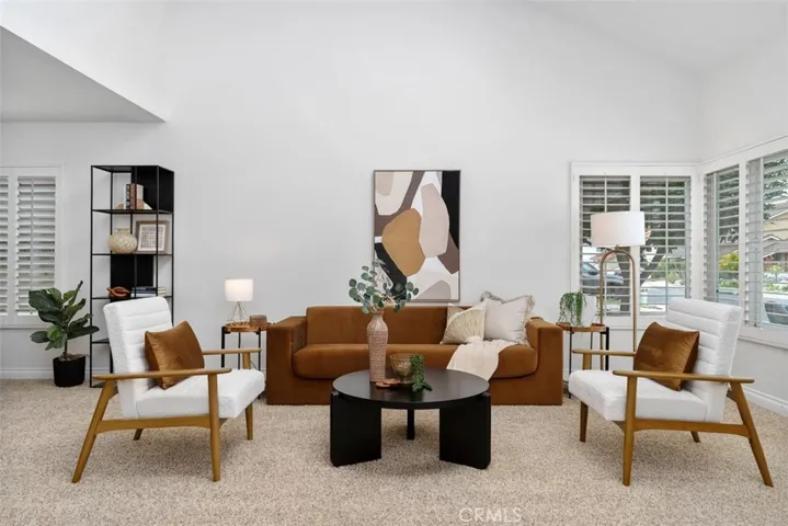 Living room with skylight and double pane windows.