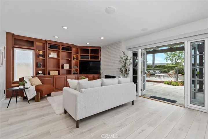 Custom built in bookshelves & beautiful French doors.
