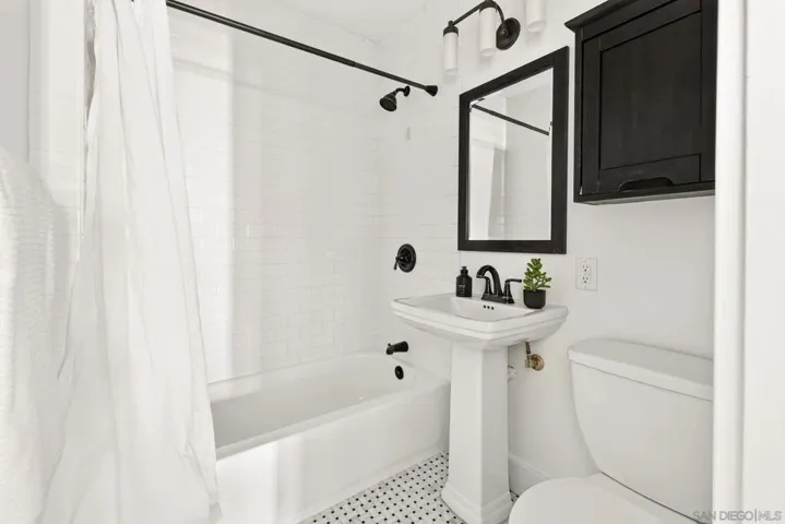 Beautiful bathroom with so much character and charm.