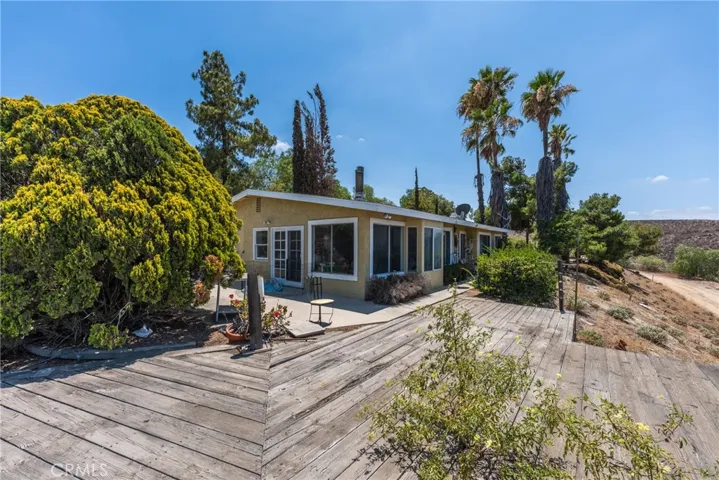 Front of Home with Wooden Deck